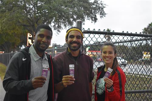 coaches holding tickets to a game 